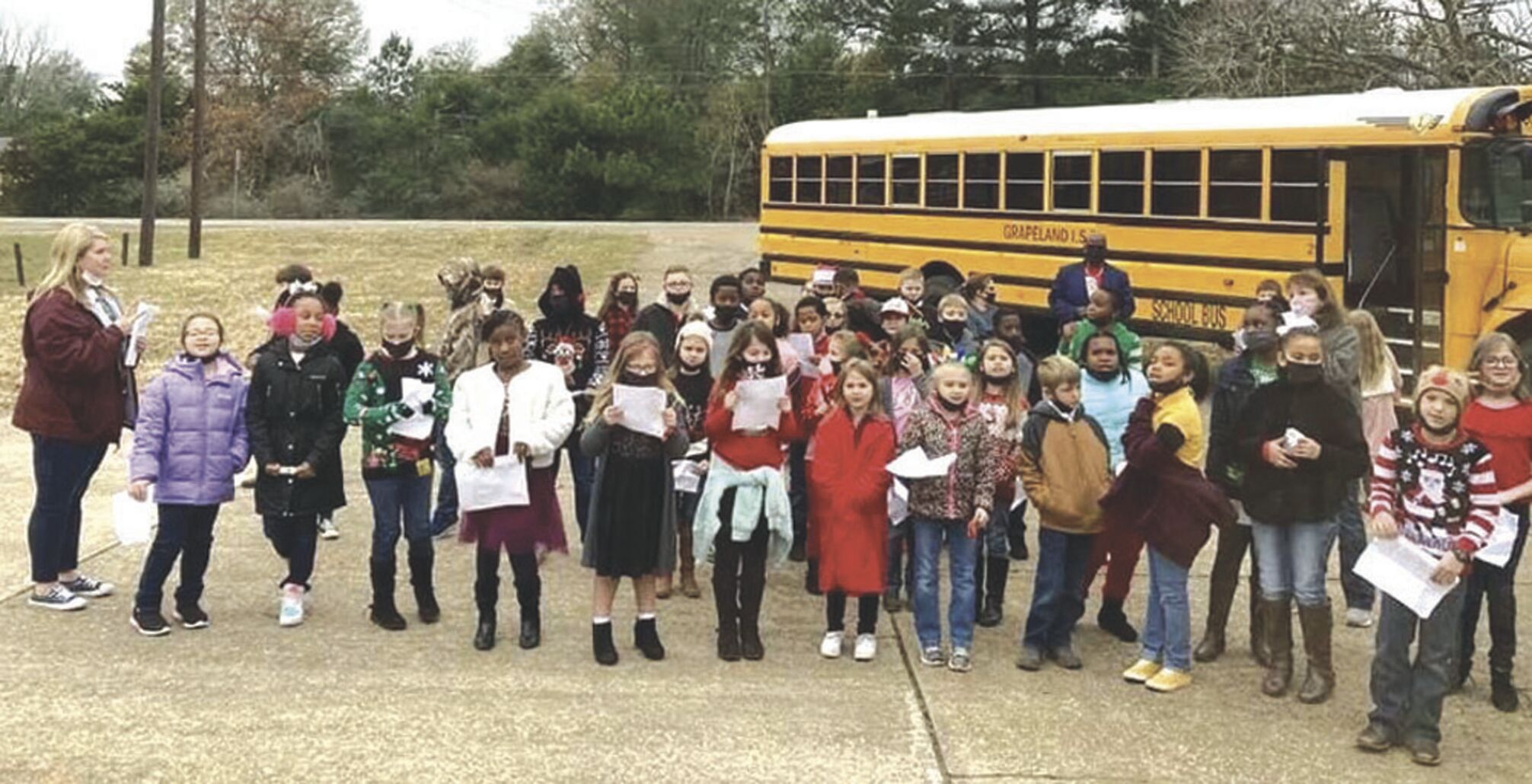 Christmas Carolers sing for local businesses